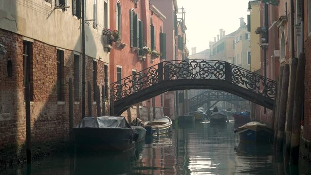 bridges and channels in venice on foggy winterday
