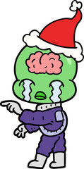 line drawing of a big brain alien crying and pointing wearing santa hat