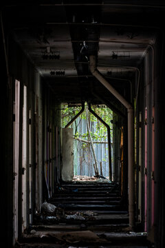 A long corridor of shadows and light in an abandoned site in Bangkok