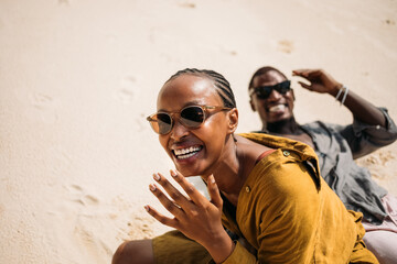 Naklejka premium Woman and Man Enjoying at Beach