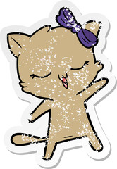 distressed sticker of a cartoon cat with bow on head