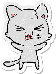distressed sticker of a cartoon hissing cat