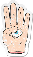 retro distressed sticker of a cartoon spooky hand with eyeball