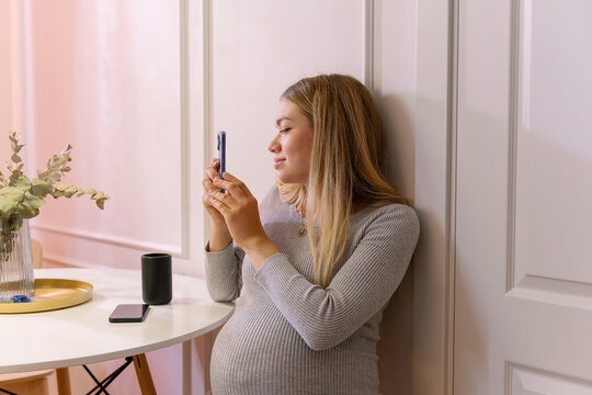 Stylish Pregnant Woman Taking A Photo