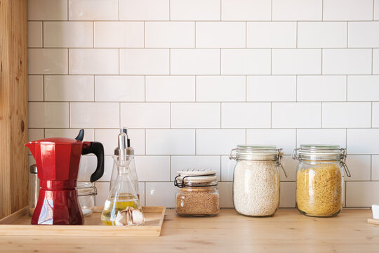 Food jars and coffee maker on countertop kitchen - Powered by Adobe