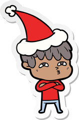 sticker cartoon of a curious man wearing santa hat