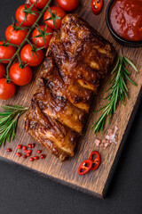 Delicious grilled pork ribs with sauce, spices and herbs