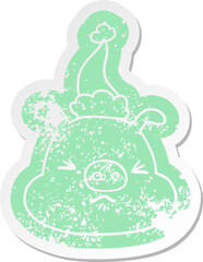 cartoon distressed sticker of a angry pig face wearing santa hat