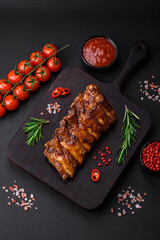 Delicious grilled pork ribs with sauce, spices and herbs
