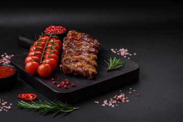 Delicious grilled pork ribs with sauce, spices and herbs