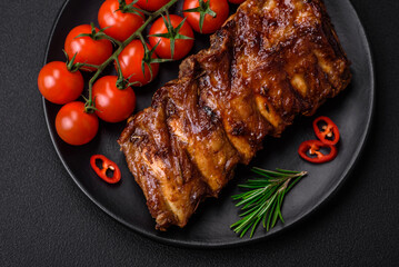 Delicious grilled pork ribs with sauce, spices and herbs