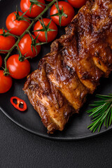Delicious grilled pork ribs with sauce, spices and herbs