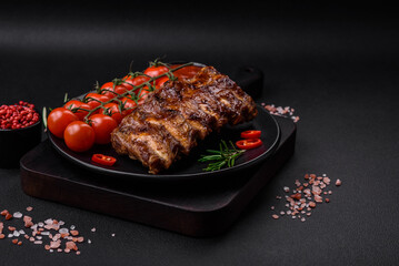 Delicious grilled pork ribs with sauce, spices and herbs