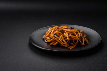 Delicious noodles or udon with mushrooms, salt, spices and herbs