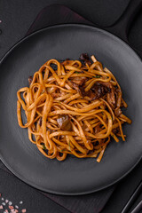 Delicious noodles or udon with mushrooms, salt, spices and herbs