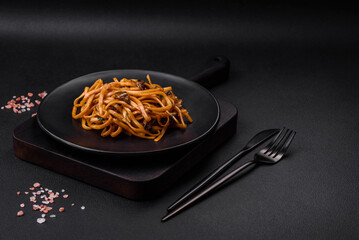 Delicious noodles or udon with mushrooms, salt, spices and herbs