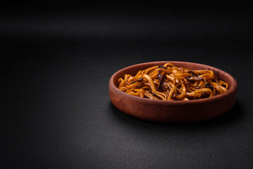 Delicious noodles or udon with mushrooms, salt, spices and herbs
