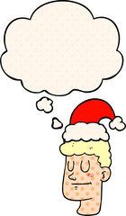 cartoon man wearing christmas hat and thought bubble in comic book style