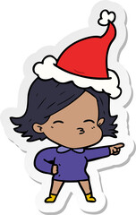 sticker cartoon of a woman pointing wearing santa hat