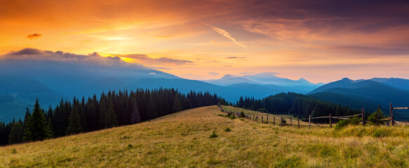 Fototapeta na wymiar Utterly spectacular view of the sunset over the mountain ranges. Carpathian mountains, Ukraine.