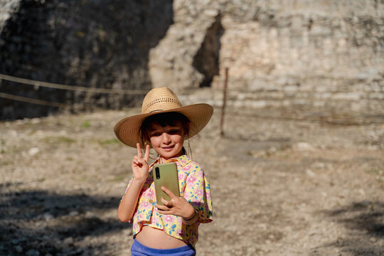 Happy girl taking selfies in Mexico travel