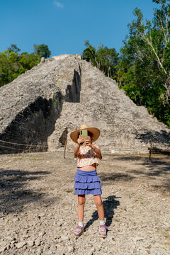 Girl taking travel selfies in Cob&aacute;, Mexico