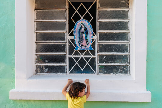 Llittle girl and Virgin of Guadalupe in Mexico trip