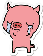 sticker of a cartoon pig crying