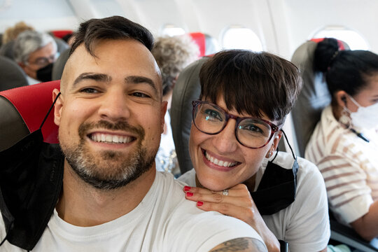 Couple Selfie In The Plane smiling