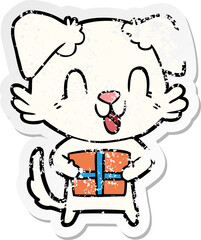distressed sticker of a laughing cartoon dog with christmas present
