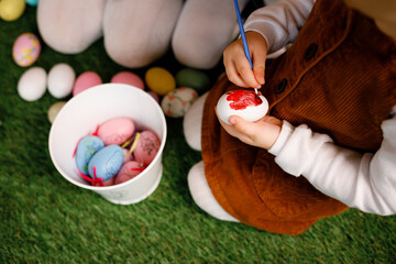 April 16, 2023. Vinnytsia, Ukraine: Girls paint eggs and play together at home on Easter