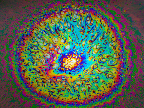 Spectacular circular abstraction of chaotic streams of bright colors