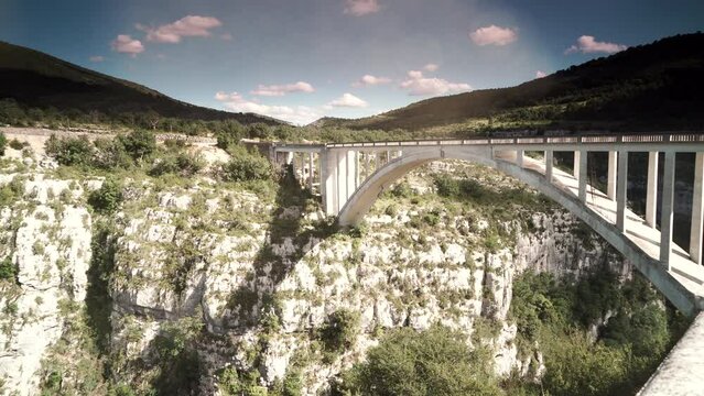 Timelapse of clouds moving above mountains landscape. Verdon Gorge in French Alps with Chauliere Bridge over the Artuby river,  Provence France. Viewpoint Pont de l'Artuby.