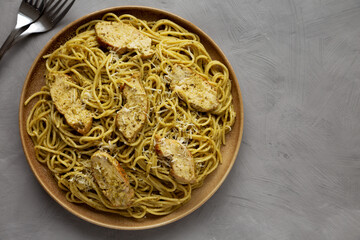 Homemade Pesto alla Genovese Pasta on a Plate, top view. Flat lay, overhead, from above. Copy space.