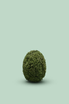 Single handicraft Easter egg made of moss.