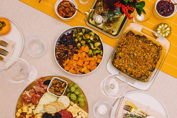 Top view of the table with Thanksgiving dishes and decor,