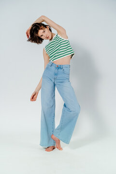 Stylish model in top and jeans