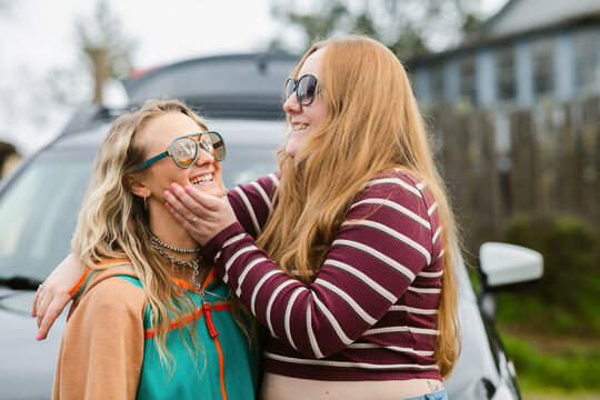 Happy female friends joking on vacation