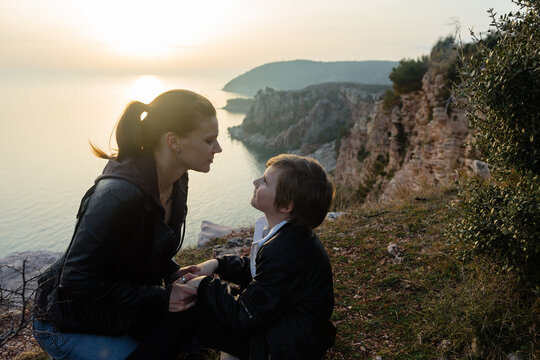 Mother and little son above the sea