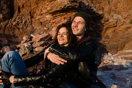 Smiling couple in the red rock 