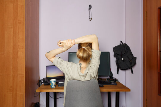Female student against computer at home