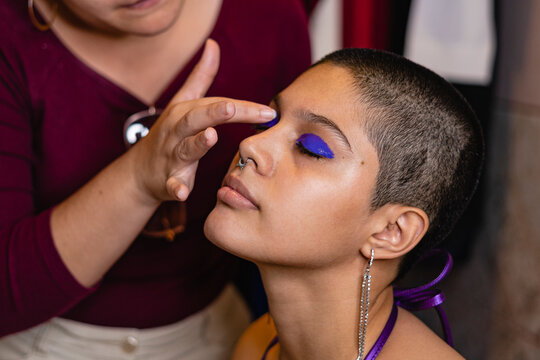 Portrait of a bisexual woman being made up
