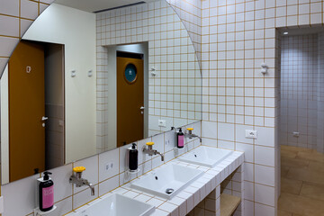 A clean modern shared bathroom inside a hostel