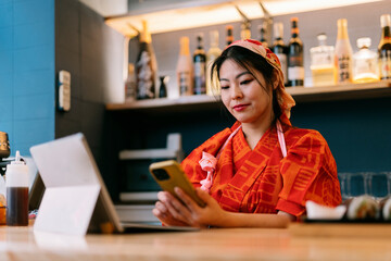Owner of restaurant working on cellphone in the night club