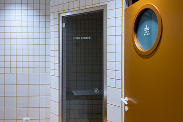 A clean modern shared bathroom inside a hostel