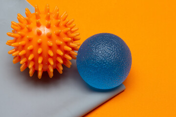 .two small pilates balls on an elastic band