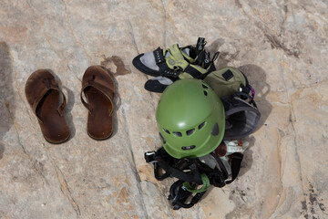 Climbing helmet, shoes and flip flops