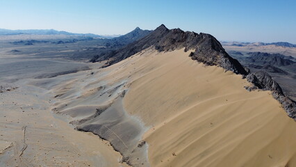 Fototapeta na wymiar golden desert with high mountain in balochistan