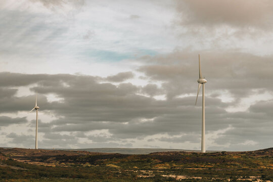 Windmills Close To The mountains, cloudy sky 