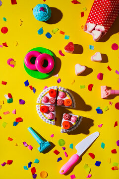 birthday cake, donuts, cupcakes, party horns and confetti